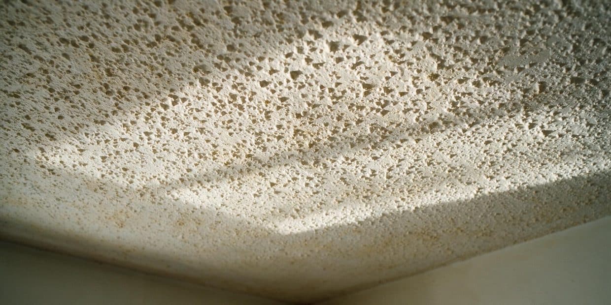Popcorn ceiling asbestos: the years, the test, and what not to touch